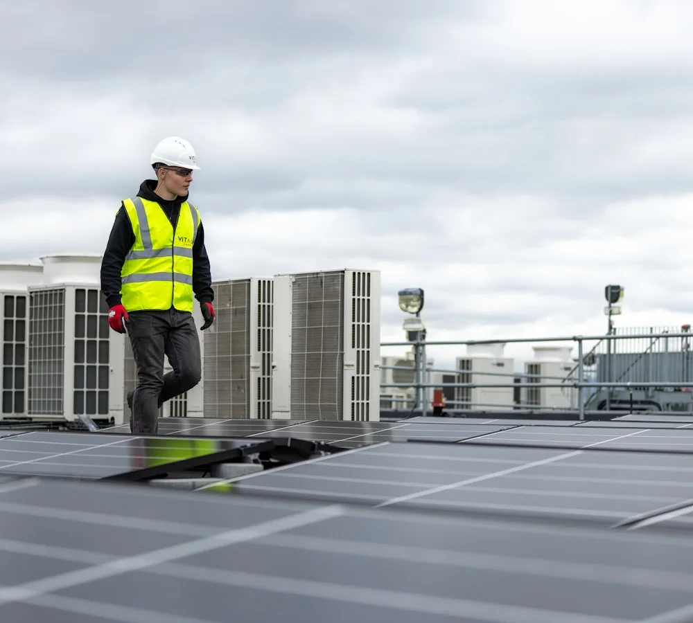 HVAC technician inspecting rooftop equipment